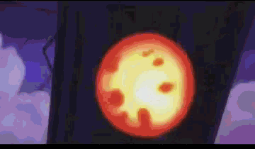 a close up of a red and yellow circle with a purple background