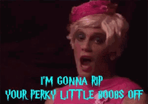 a woman in a pink dress and crown says i 'm gonna rip your perky little boobs off