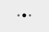 a white background with three black circles and a gray circle in the middle .