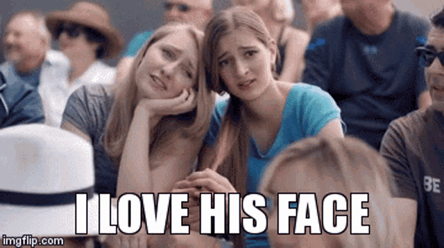 a group of people are sitting in a stadium and one of them is crying and the caption says i love his face