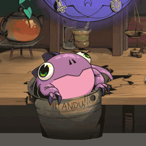 a purple frog is sitting in a bucket that says andu