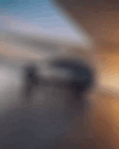 a blurred image of a car parked in a garage