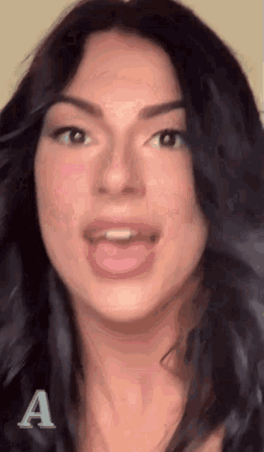 a close up of a woman 's face with the letter a visible