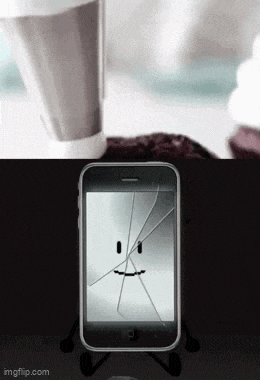 a cell phone with a cracked screen and a face on it .