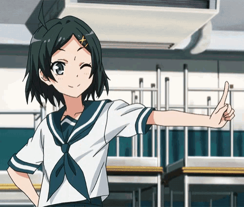 a girl in a sailor uniform is giving a thumbs up