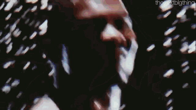 a man in a wrestling ring with the nextbigthing written on the bottom