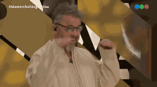 a man with glasses and a beard is on a masterchef argentina show