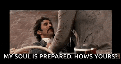 a man with a mustache is talking to another man in a car and the man is asking how his soul is prepared .