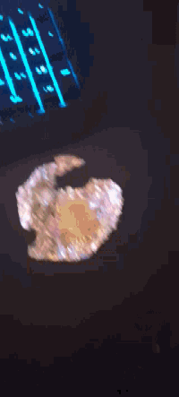 a close up of a person 's face with a black spot on their eye