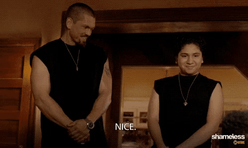 a man and a woman are standing next to each other and the woman is saying " nice "