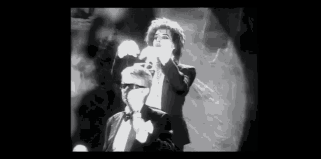 a black and white photo of a man and a woman