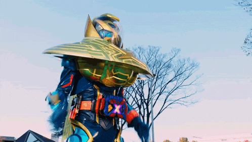 a man in a costume with a belt that says x on it