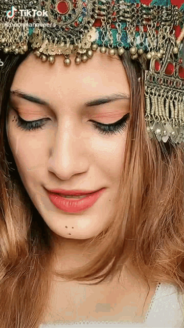 a close up of a woman 's face with a tiktok watermark