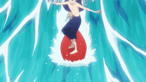 a boy is riding a red float in the ocean