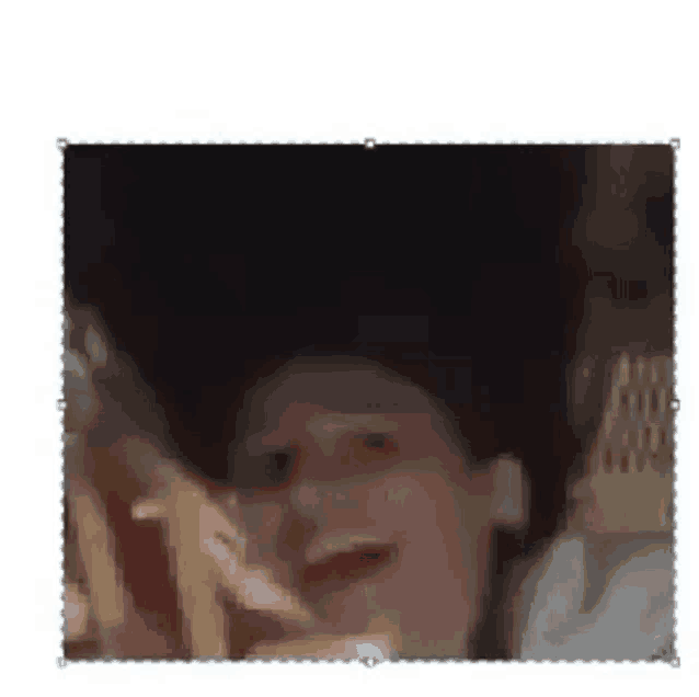 a close up of a person 's face with their mouth open and a blurred background .