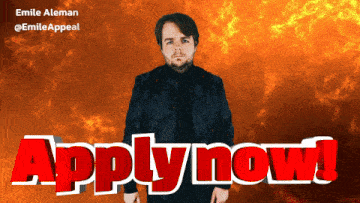 a man in a black jacket is standing in front of a sign that says apply now