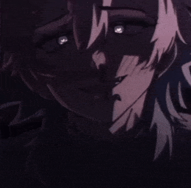 a close up of a person 's face with their eyes glowing in the dark