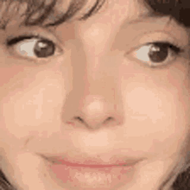 a close up of a person 's face with their eyes closed and their mouth open .