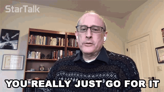 a man says you really just go for it in front of a bookshelf