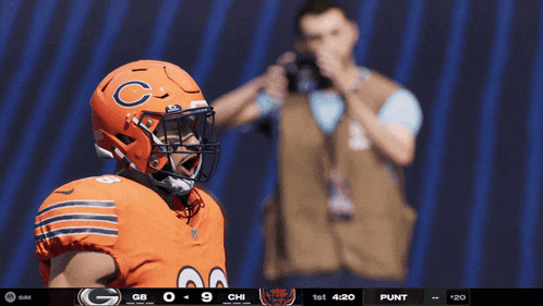 a football player wearing a helmet with a c on it