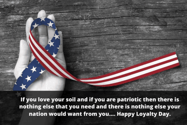 a hand is holding an american flag ribbon with a quote on the bottom