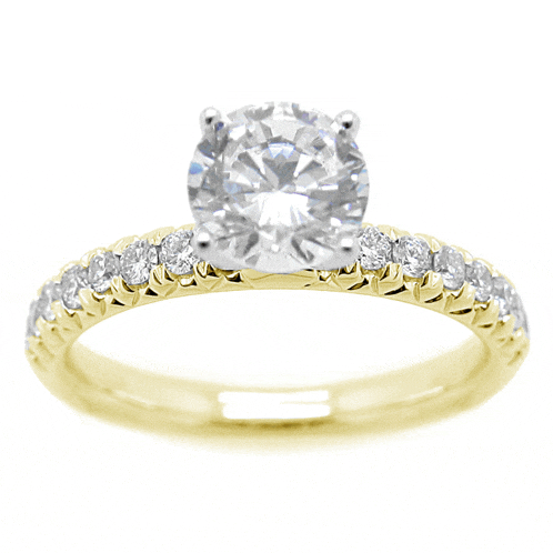 a yellow gold ring with a diamond in the middle