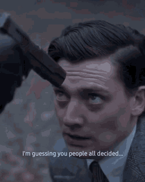 a close up of a man 's face with the words who could ever kill tommy shelby