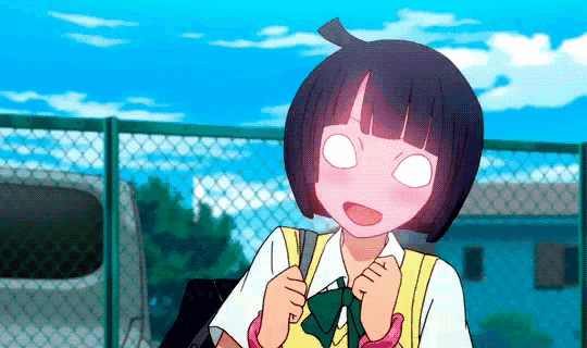 a girl with short black hair is standing in front of a chain link fence with her eyes closed .