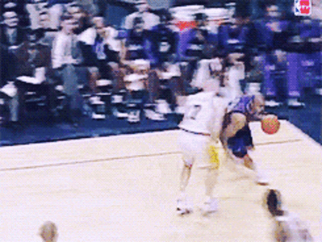 a basketball player with the number 7 on his jersey is dribbling a basketball