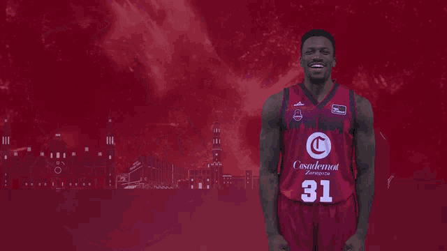 a basketball player named dylan ennis is flexing his muscles