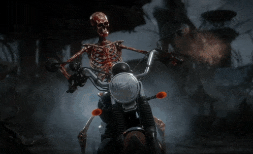 a close up of a motorcycle 's front wheel with a red light