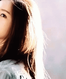 a close up of a woman with long hair