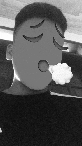 a black and white photo of a person with an emoji face