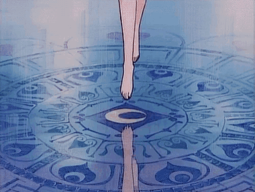 a woman 's feet are standing in a circle with a crescent moon in the middle