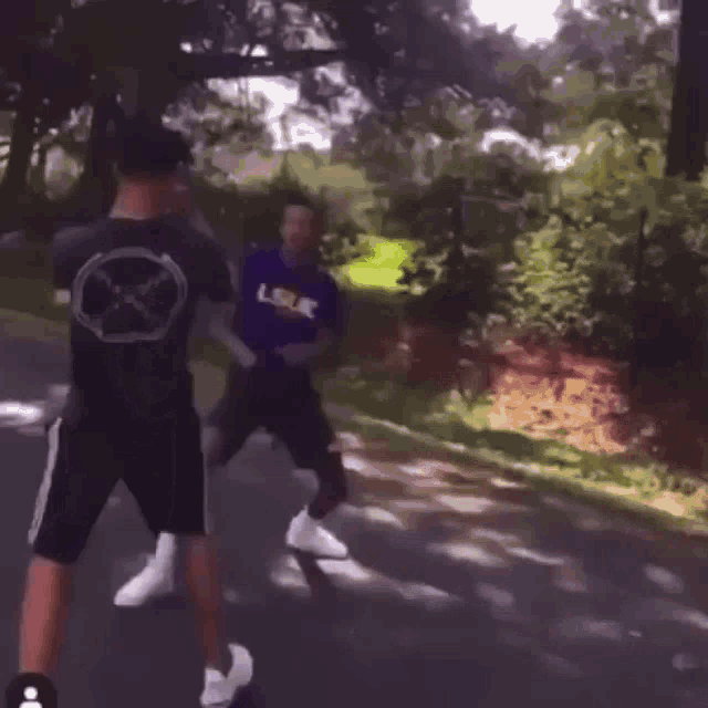 a person is dancing on the side of the road