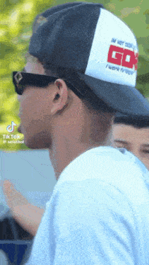 a man wearing a hat that says i 'm not your go