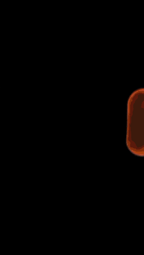 a person is standing in front of a fire