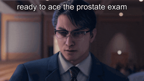 a man in a suit and tie is ready to ace a prostate exam