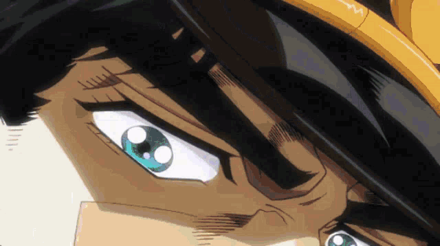 a close up of a man 's face with blue eyes