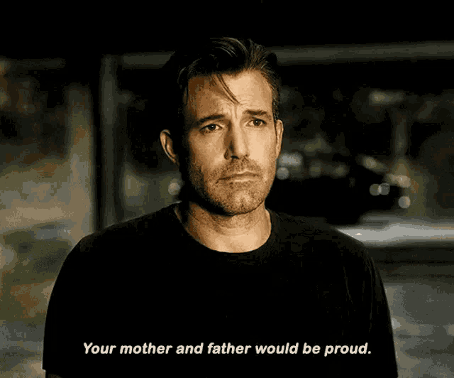 a man in a black shirt is talking about his mother and father