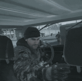 a man in a car with the words " makarov money can buy many things even power " below him