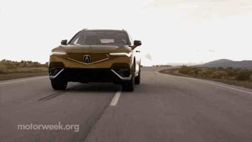 a car is driving down a road with motorweek.org written on the bottom right