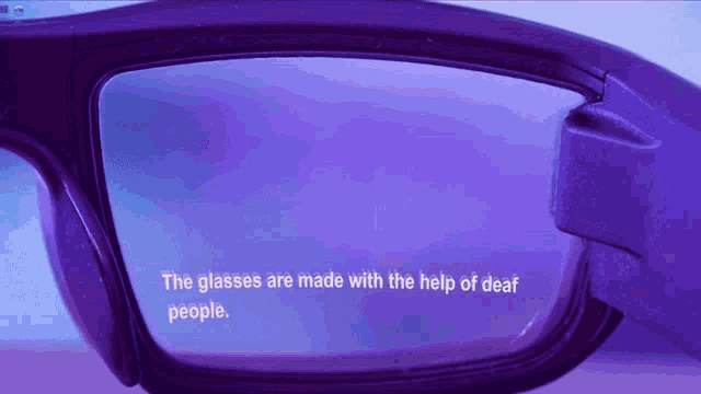 a pair of glasses with the words " the glasses are made with the help of deaf people " on the lens