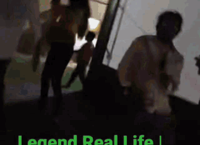 a blurred image of people with the words legend real life at the top
