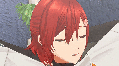 a girl with red hair has her eyes closed and a flower on her forehead