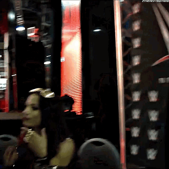a blurred image of a woman with the hashtag #thenextbigthing