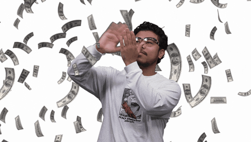 a man wearing a shirt that says poco thousand is surrounded by money