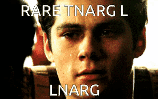 a close up of a man 's face with the words rare tnarg l lnarg on the bottom