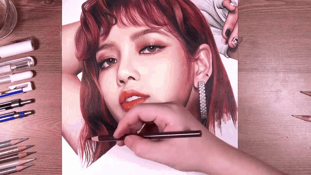 a drawing of a woman with red hair is being drawn