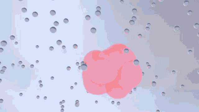a pink balloon is floating in the air surrounded by bubbles .